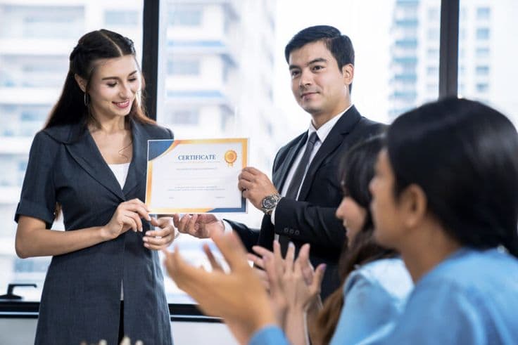 An organisation receiving its accreditation certificate